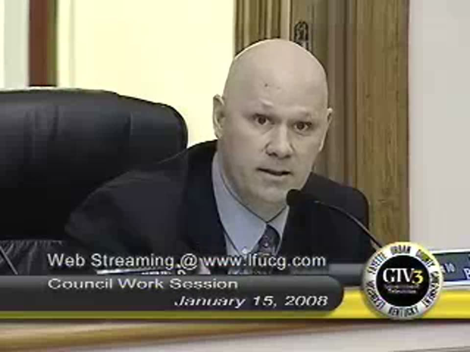 Councilmember Don Blevins at the council dais on January 15, 2008, mid-sentence, asking whether Lexington really wants to wait further while sewage flows on the streets