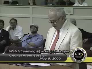 Dudley Webb reading a statement at the council podium, May 5, 2009