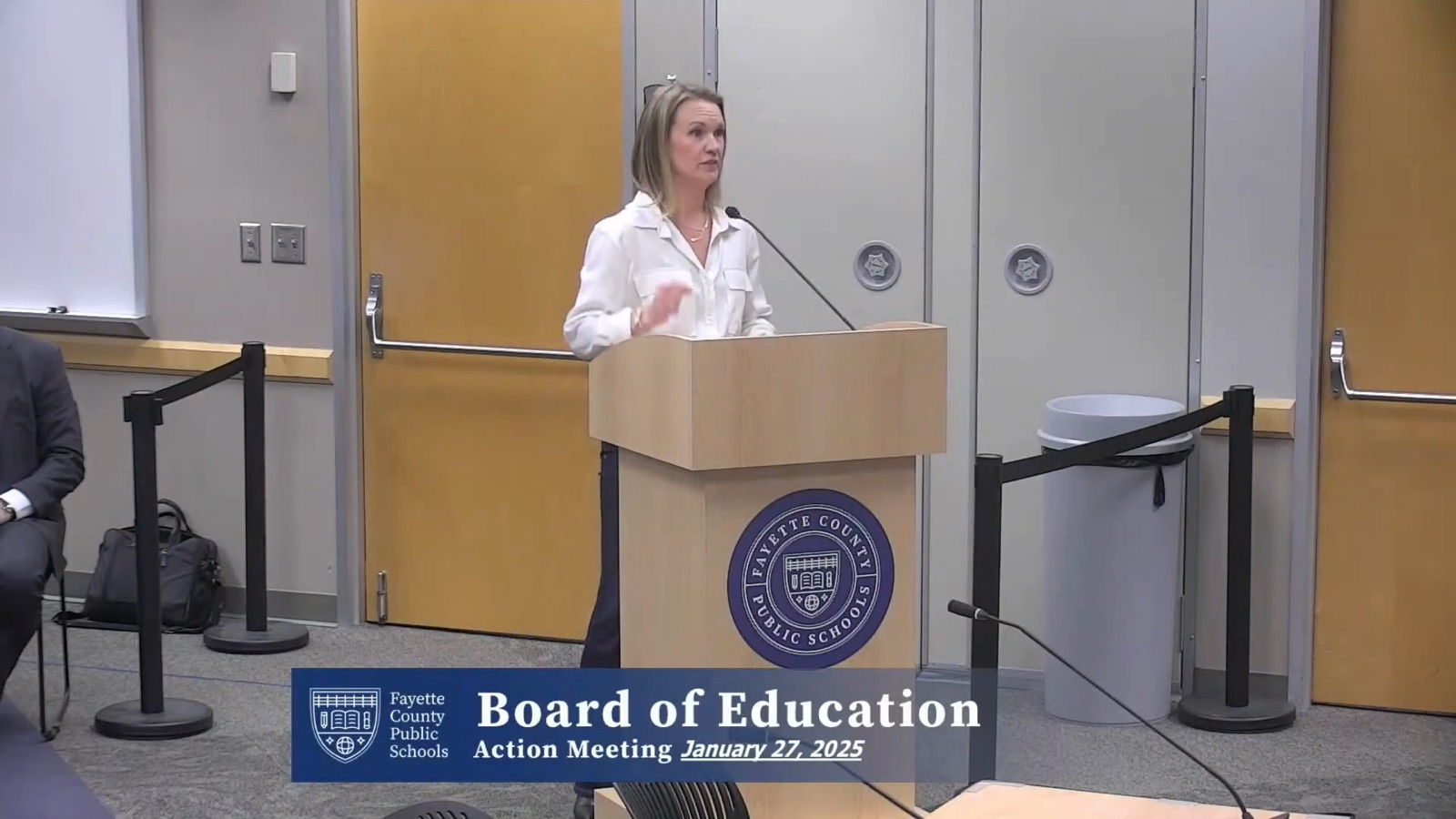 Rachel Buser speaking at the public-comment podium