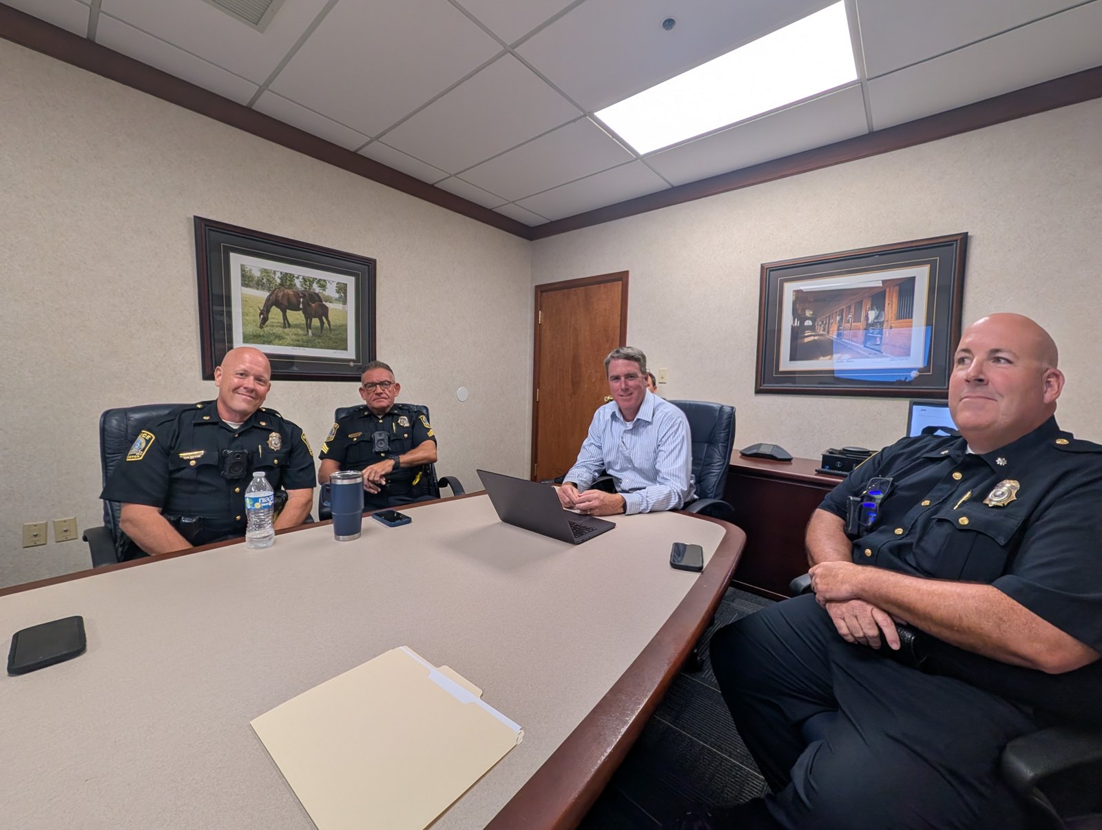 Four Lexington police officials seated around a conference table