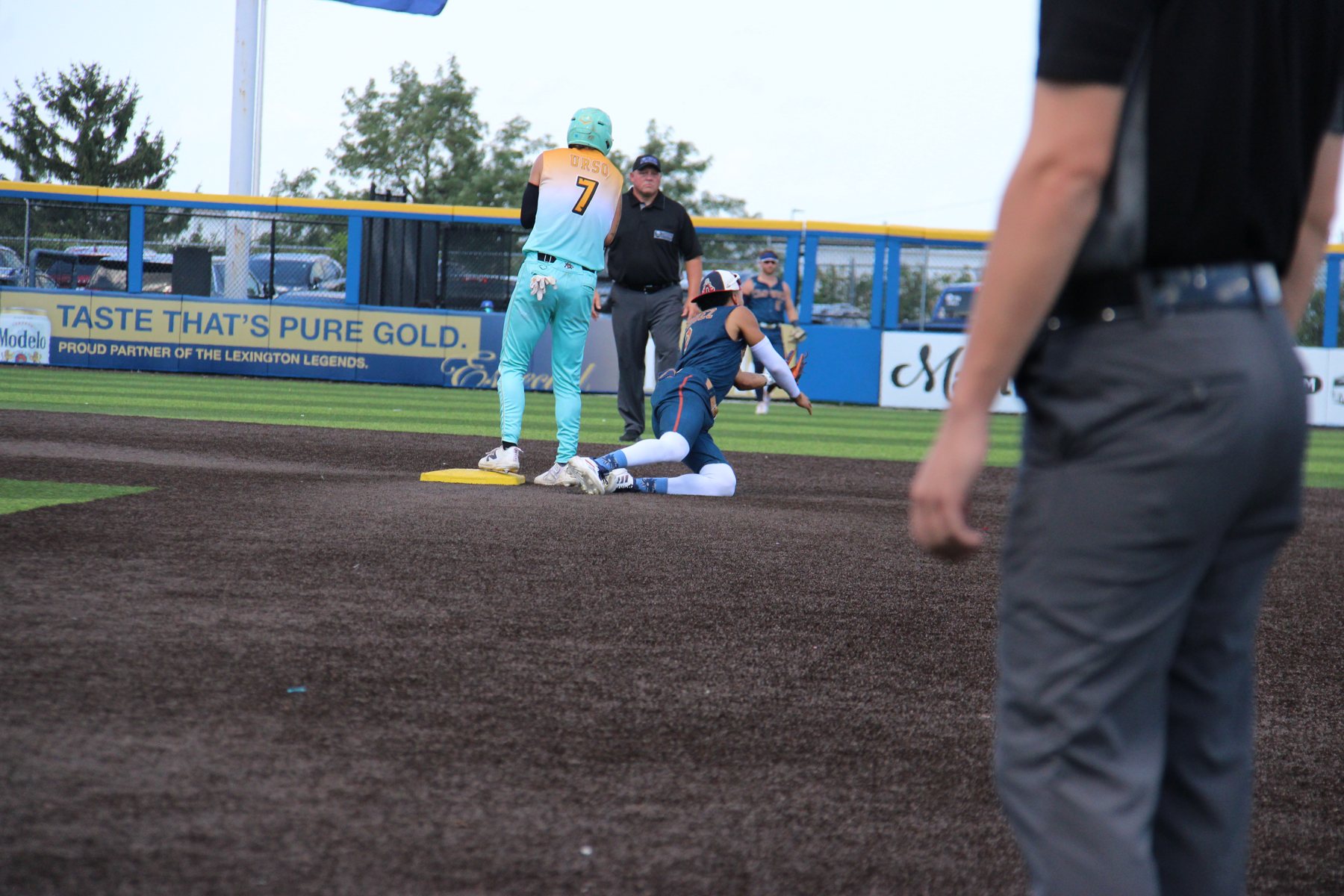 A Clowns infielder slides into second.